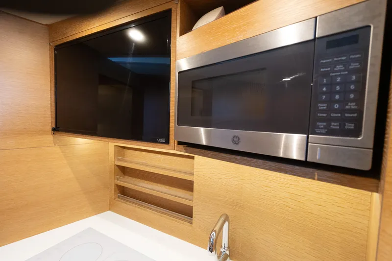 Slide: The Image of Modern kitchen area in 2020 Scout 530LXF with microwave and TV. - 42