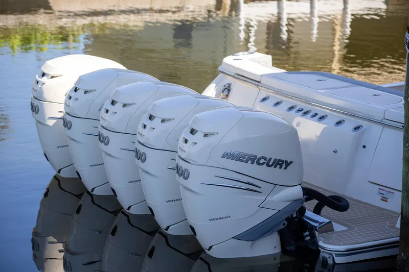 Slide: The Image of 2020 Scout 530LXF boat with five Mercury outboard engines on water. - 5