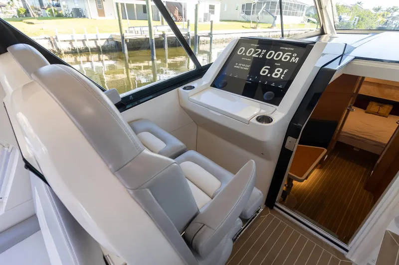 Slide: The Image of 2020 Scout 530LXF boat interior with modern dashboard and seating. - 8