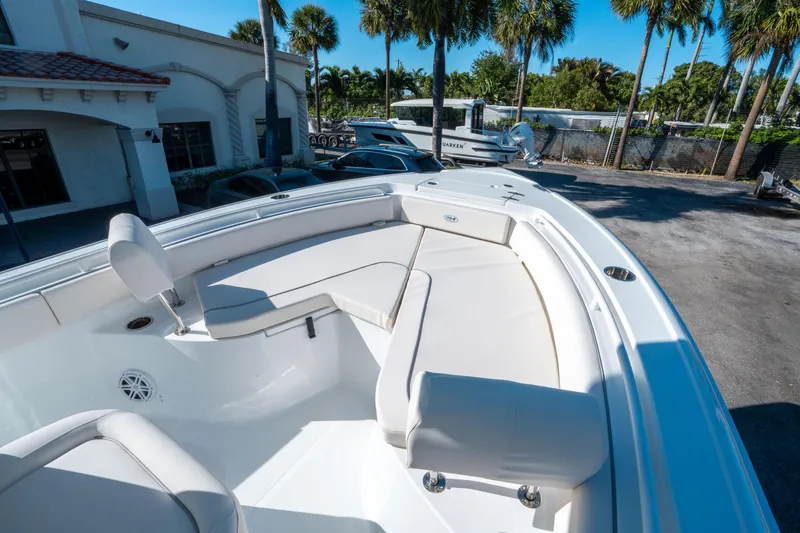 Slide: The Image of 2025 Sea Hunt Ultra 235 SE boat with spacious seating and sleek design. - 21
