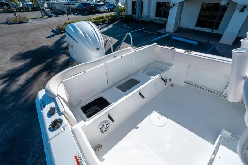 Slide: The Image of 2025 Sea Hunt Ultra 235 SE boat interior with storage compartments and Yamaha engine. - 13