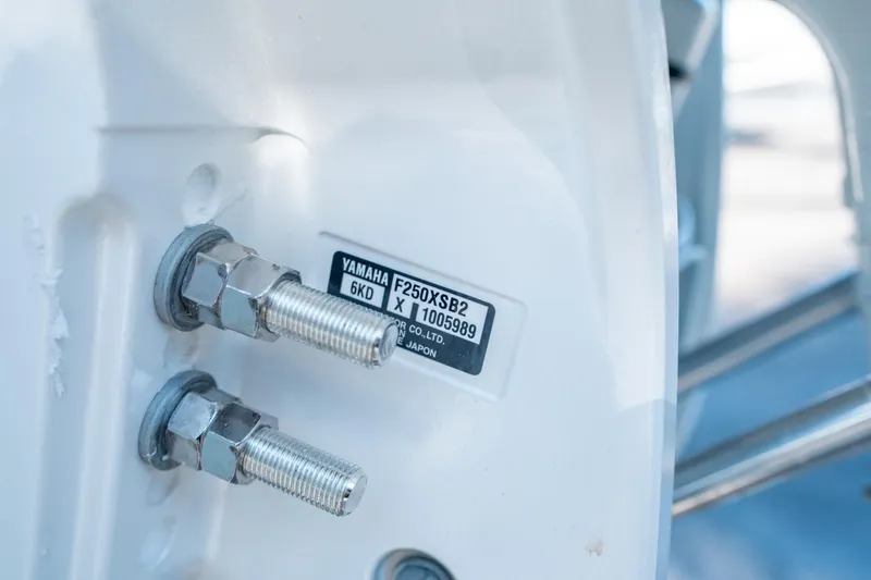 Slide: The Image of Close-up of Yamaha F250XSB2 engine bolts on 2025 Sea Hunt Ultra 235 SE. - 27