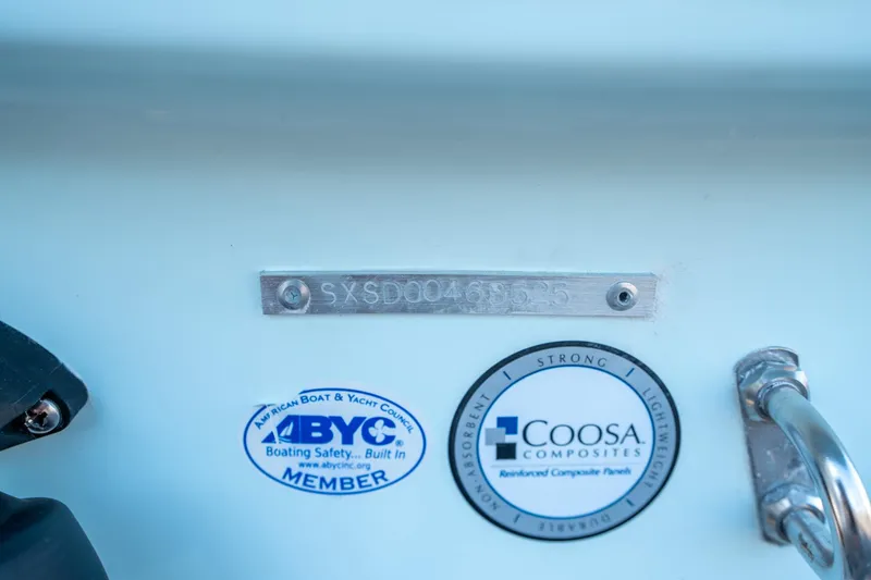 Slide: The Image of 2025 Sea Hunt Ultra 235 SE boat with ABYC and Coosa Composites labels. - 28