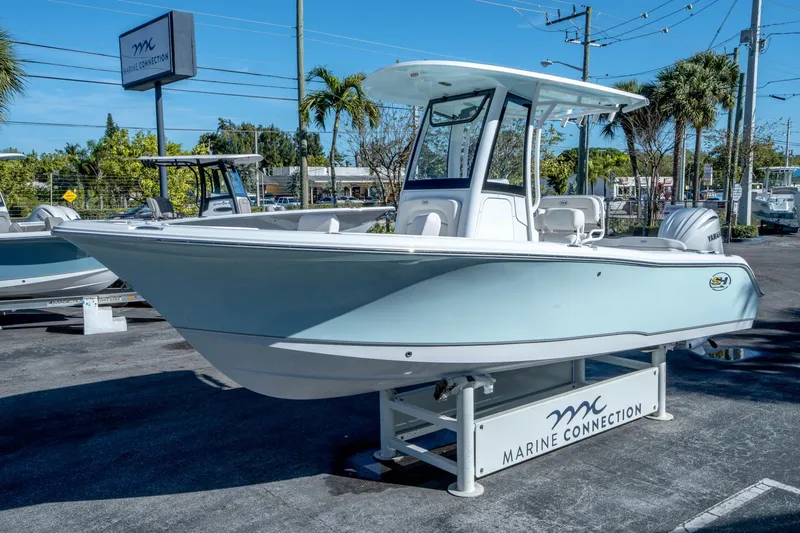 Slide: The Image of 2025 Sea Hunt Ultra 235 SE boat displayed at Marine Connection dealership. - 6
