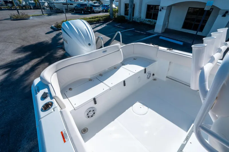 Slide: The Image of 2025 Sea Hunt Ultra 235 SE boat interior with seating and storage compartments. - 12