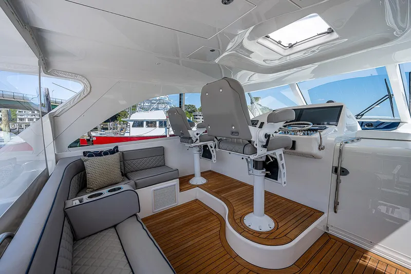 Slide: The Image of Luxurious interior of 2012 Cabo 44 HTX yacht with modern seating and helm. - 24