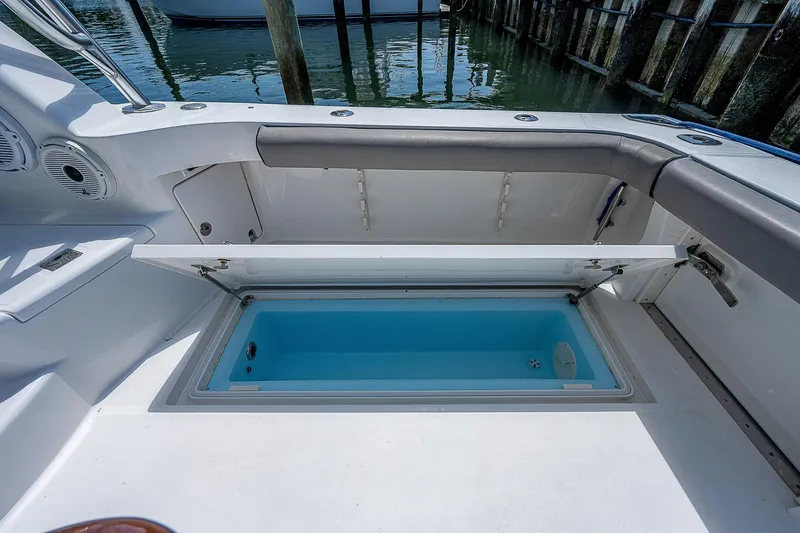 Slide: The Image of Cabo 44 HTX 2012 boat with open storage compartment on deck. - 48