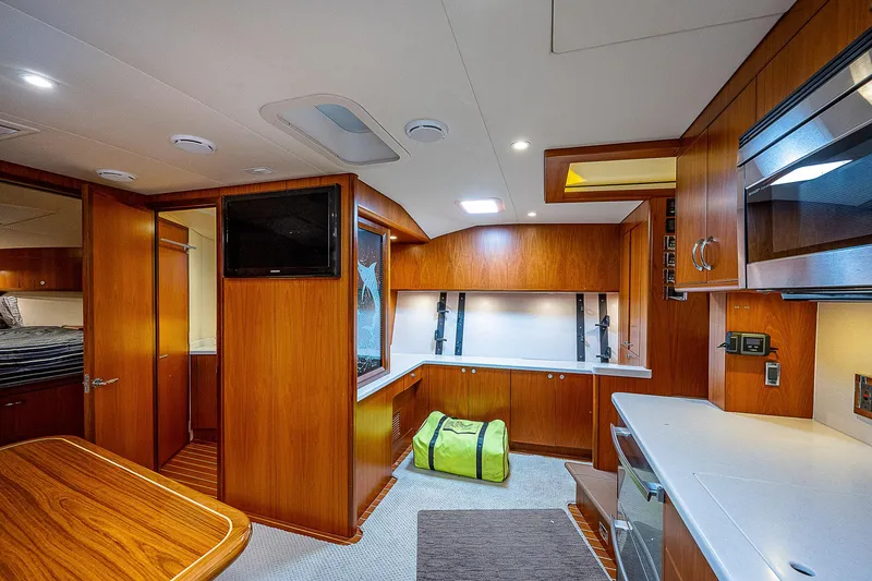 Slide: The Image of Luxurious interior of 2012 Cabo 44 HTX yacht with wood finish and modern amenities. - 9