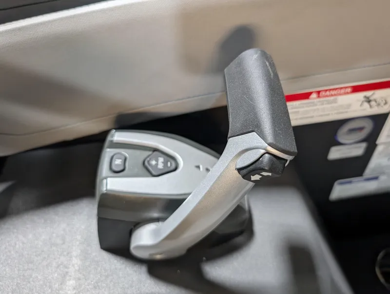 Slide: The Image of Control lever of 2025 Manitou Cruise boat, featuring ergonomic design and intuitive buttons. - 11