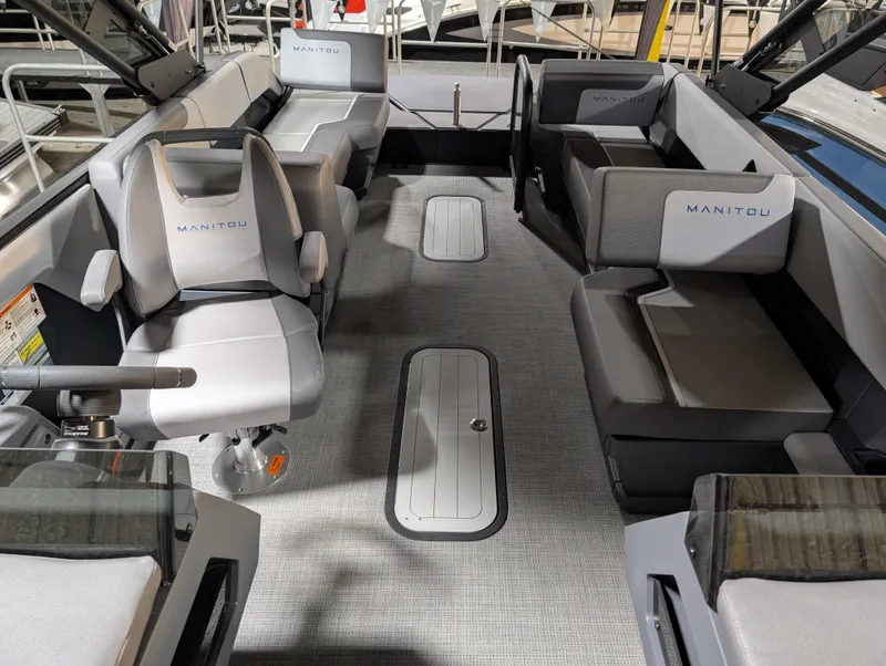 Slide: The Image of 2025 Manitou Cruise boat interior with modern seating and sleek design. - 7