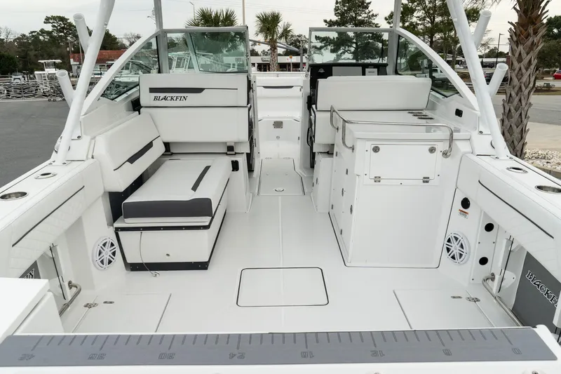Slide: The Image of 2023 Blackfin 272 DC boat interior with seating and storage compartments. - 12