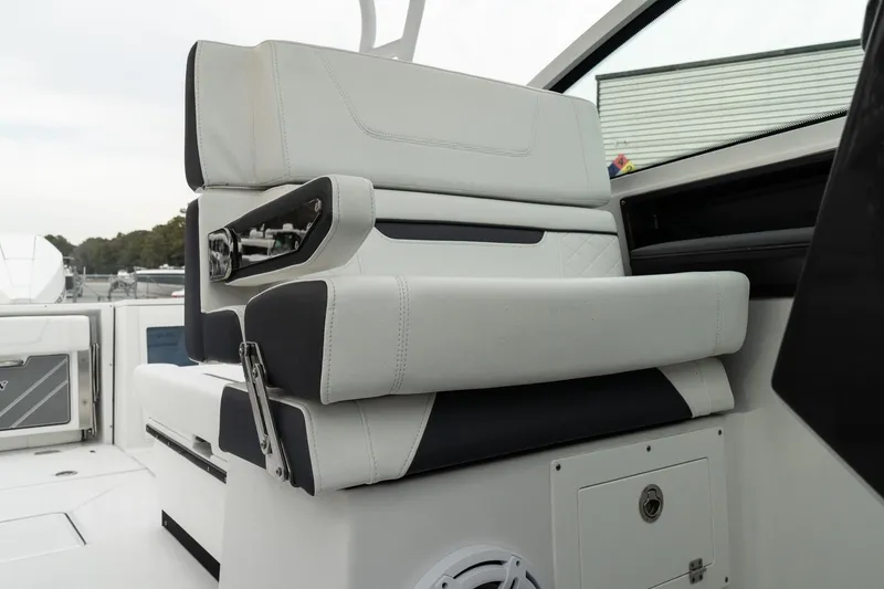 Slide: The Image of Luxury seating on 2023 Blackfin 272 DC boat, featuring sleek white and black upholstery. - 22