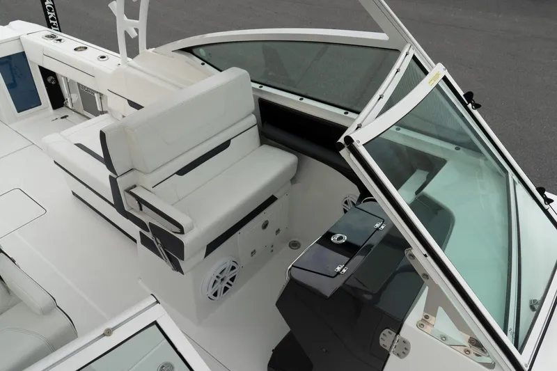 Slide: The Image of 2023 Blackfin 272 DC boat interior with white seating and sleek design. - 24