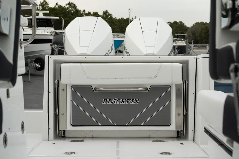 Slide: The Image of 2023 Blackfin 272 DC boat with dual outboard engines, rear seating view. - 26