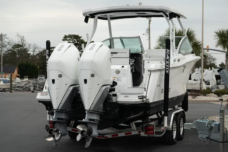 Slide: The Image of 2023 Blackfin 272 DC boat with dual engines on a trailer. - 9