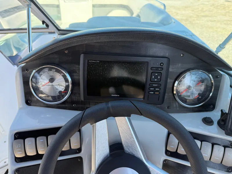 Slide: The Image of Dashboard of 2018 Hurricane SunDeck 2486 OB boat with gauges and navigation screen. - 11