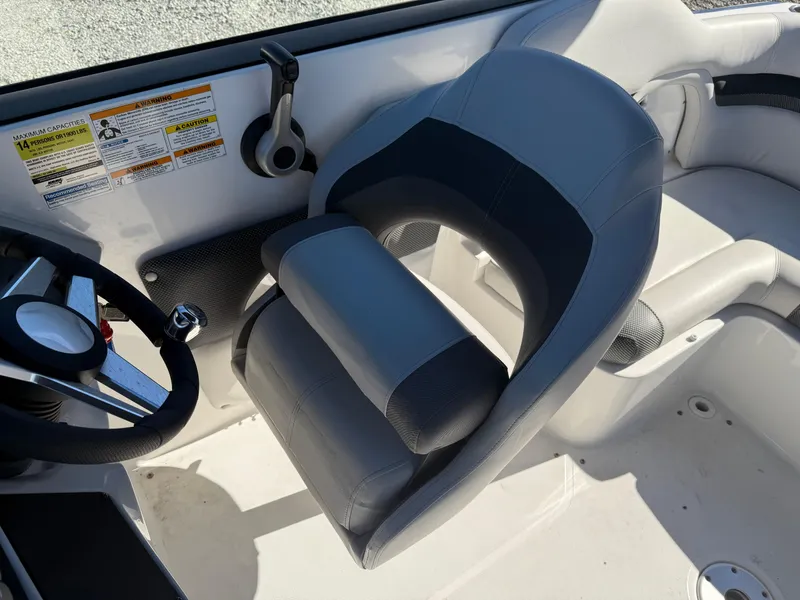 Slide: The Image of Captain's seat and steering wheel of 2018 Hurricane SunDeck 2486 OB boat. - 15