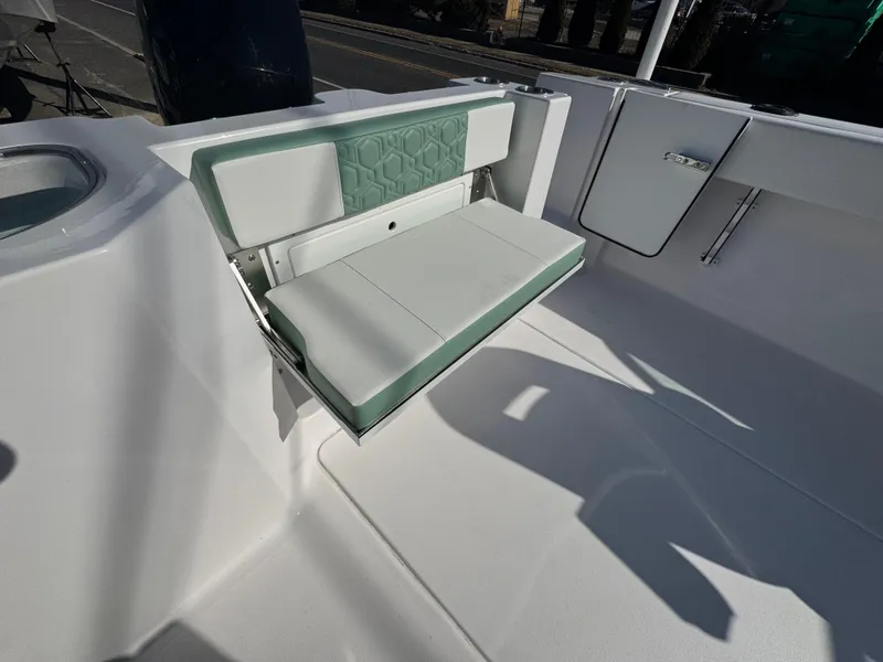 Slide: The Image of 2025 Aquasport 22AS Dual Console boat with foldable seat and modern design. - 15