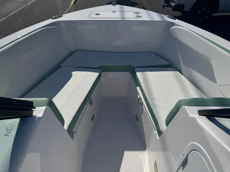 Slide: The Image of 2025 Aquasport 22AS Dual Console boat interior with cushioned seating. - 6