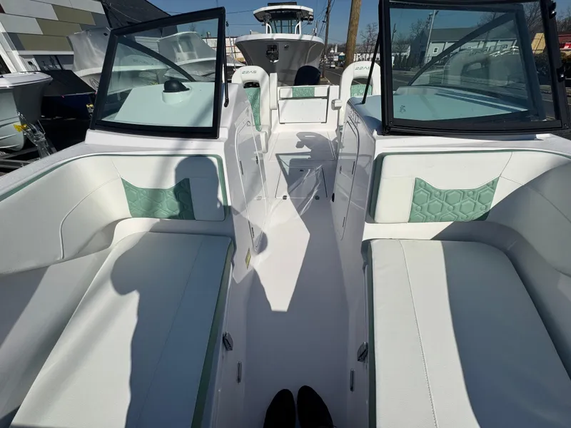 Slide: The Image of 2025 Aquasport 22AS Dual Console boat interior with open seating and modern design. - 7