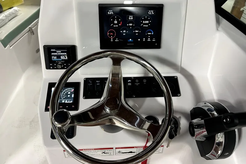 Slide: The Image of 2025 Aquasport 22AS Dual Console dashboard with steering wheel and digital displays. - 9