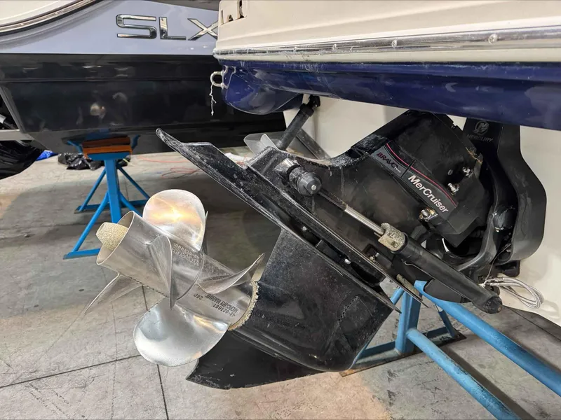 Slide: The Image of Close-up of a 2005 Sea Ray 270 Sundeck's MerCruiser Bravo Three outdrive and propeller. - 4