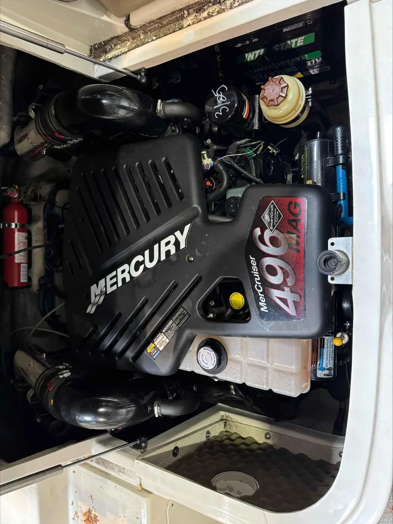 Slide: The Image of 2005 Sea Ray 270 Sundeck engine compartment with Mercury 496 MAG engine. - 5