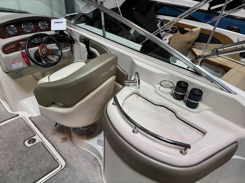 Slide: The Image of Interior of 2005 Sea Ray 270 Sundeck boat with steering wheel and dashboard. - 6