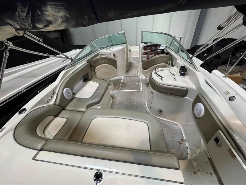 Slide: The Image of 2005 Sea Ray 270 Sundeck interior with spacious seating and modern dashboard. - 9
