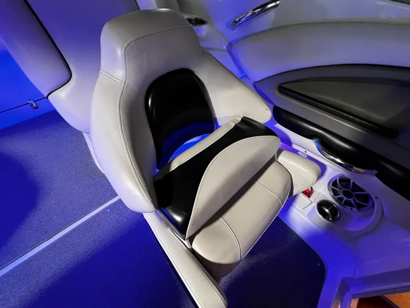 Slide: The Image of 2013 Crownline Eclipse E4 boat seat with modern design and blue ambient lighting. - 10