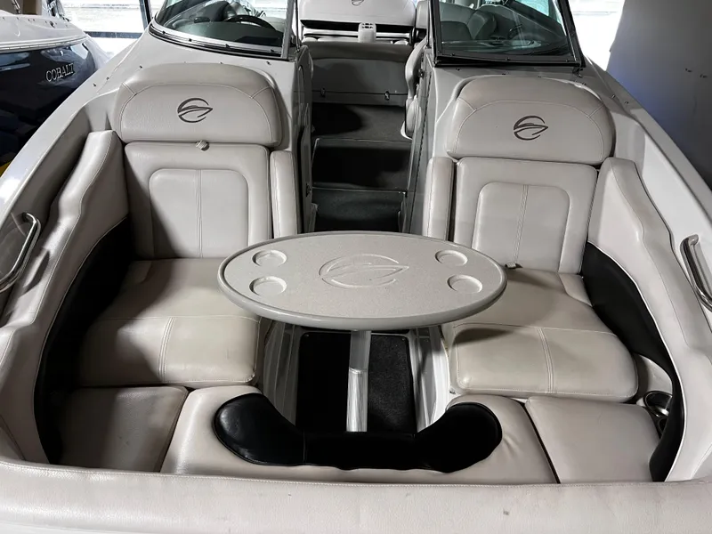 Slide: The Image of 2013 Crownline Eclipse E4 boat interior with seating and table. - 11