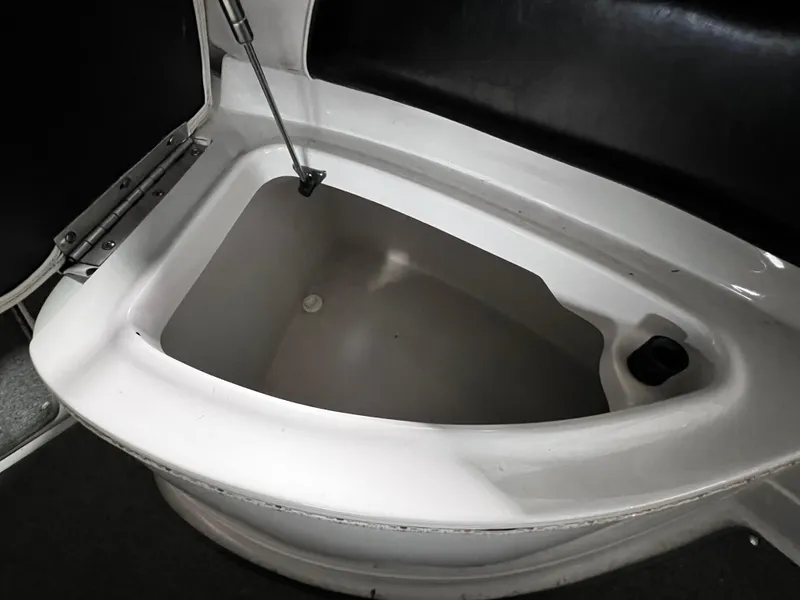 Slide: The Image of 2013 Crownline Eclipse E4 boat storage compartment, open and empty. - 16