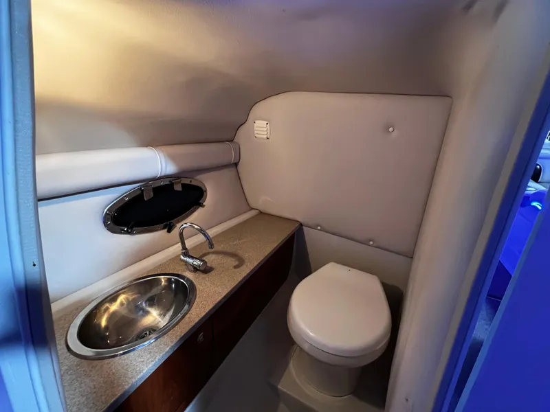 Slide: The Image of 2013 Crownline Eclipse E4 boat bathroom with sink and toilet. - 19