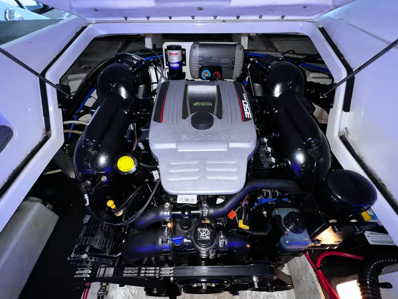 Slide: The Image of 2013 Crownline Eclipse E4 engine compartment, showcasing a powerful marine engine. - 21