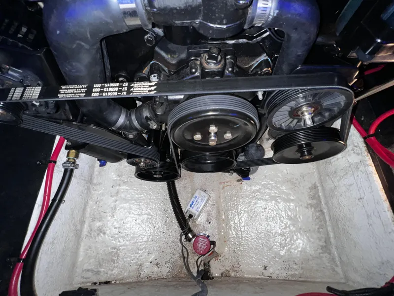 Slide: The Image of 2013 Crownline Eclipse E4 engine compartment with visible belts and pulleys. - 22