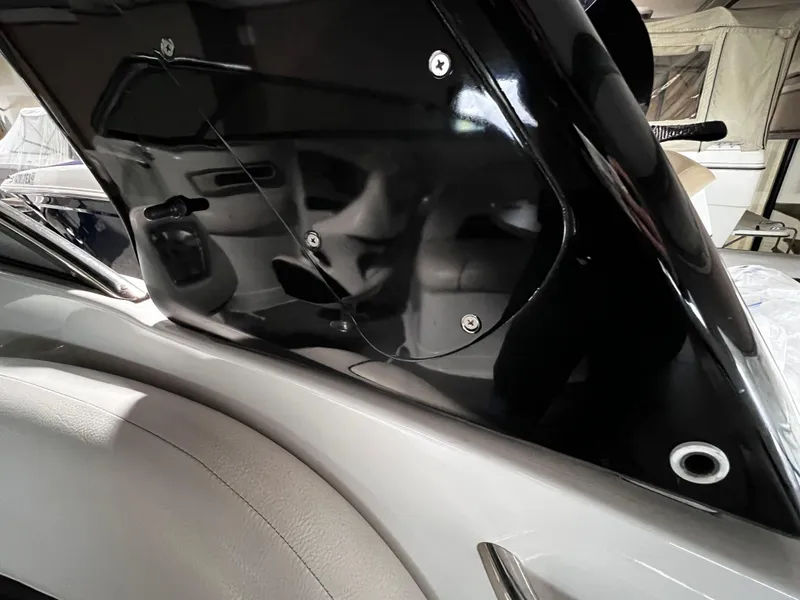 Slide: The Image of 2013 Crownline Eclipse E4 boat interior detail with sleek black paneling. - 24