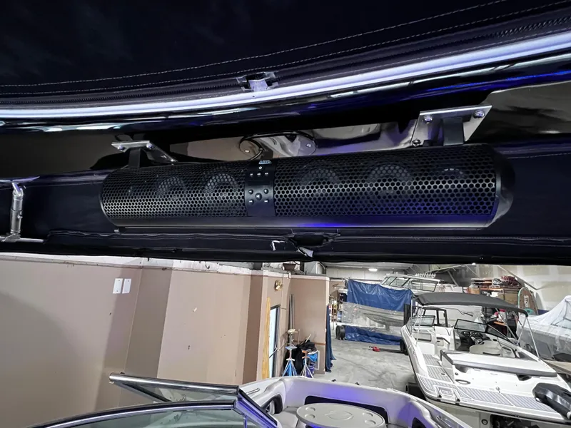 Slide: The Image of 2013 Crownline Eclipse E4 boat interior with mounted speaker system. - 25