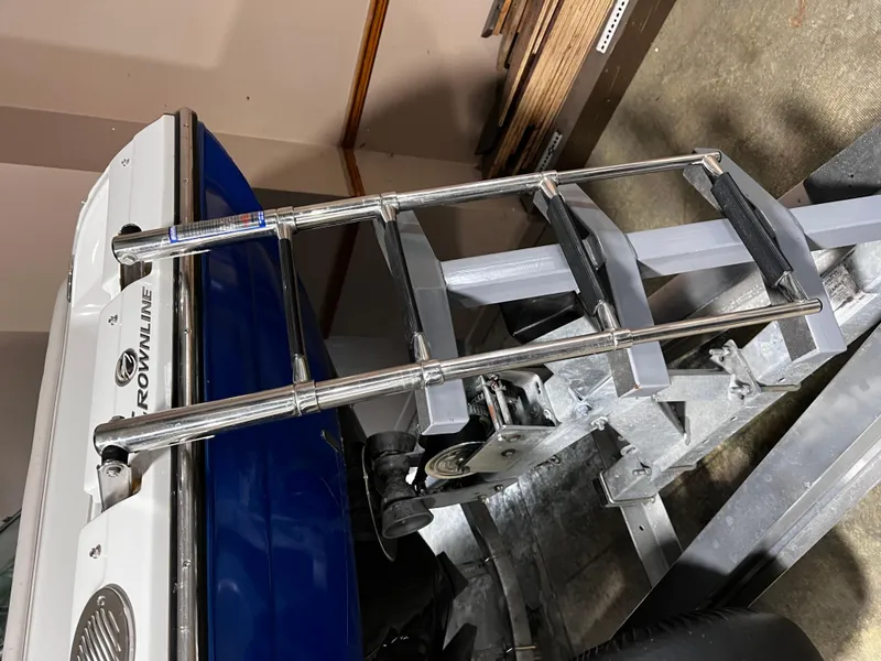 Slide: The Image of 2013 Crownline Eclipse E4 boat with a metal boarding ladder. - 28