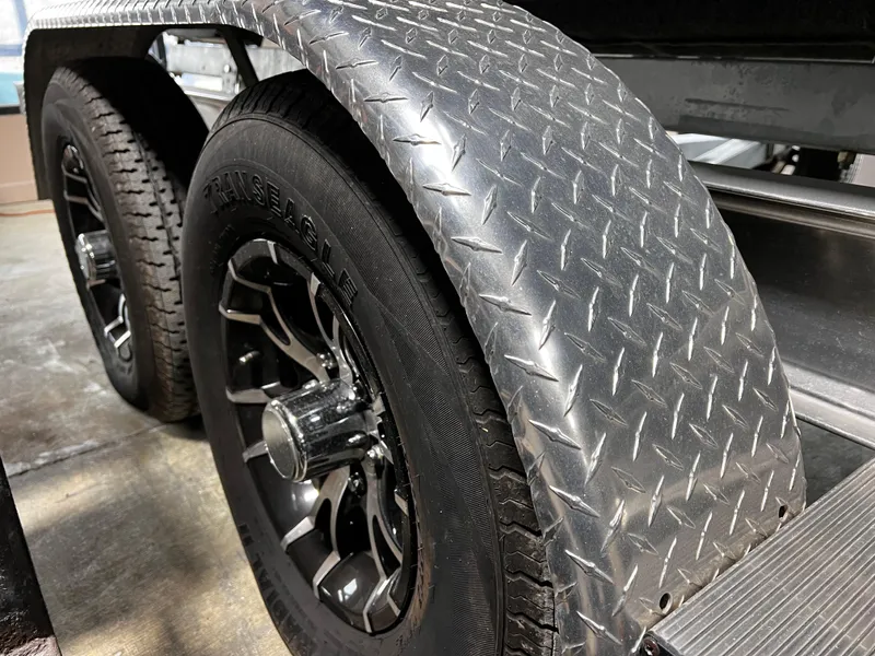 Slide: The Image of Trailer wheels with diamond plate fender, Crownline Eclipse E4, 2013 model. - 30
