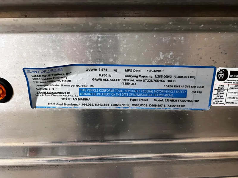 Slide: The Image of Label on a 2013 Crownline Eclipse E4 trailer, showing specifications and compliance details. - 31