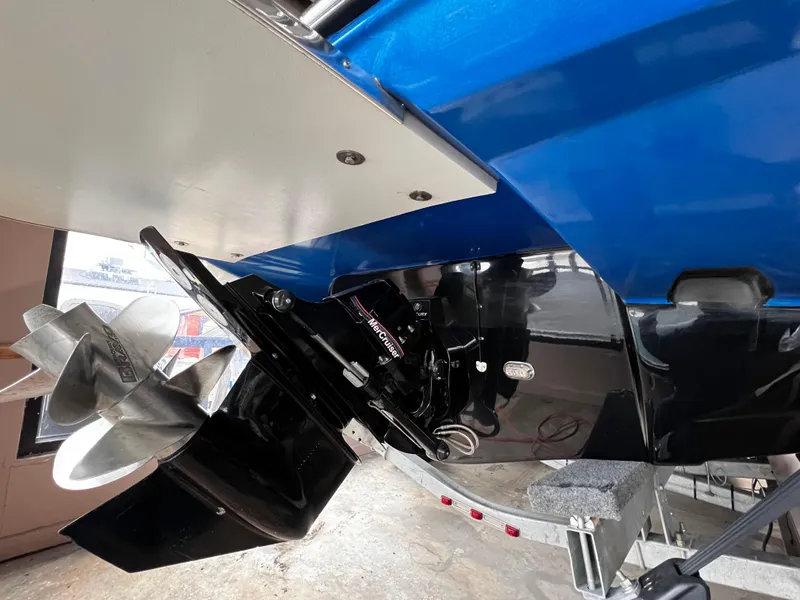 Slide: The Image of 2013 Crownline Eclipse E4 boat stern with dual propellers and blue hull. - 5