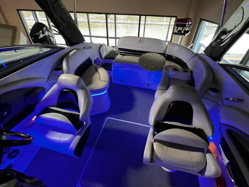 Slide: The Image of 2013 Crownline Eclipse E4 boat interior with blue LED lighting and plush seating. - 9