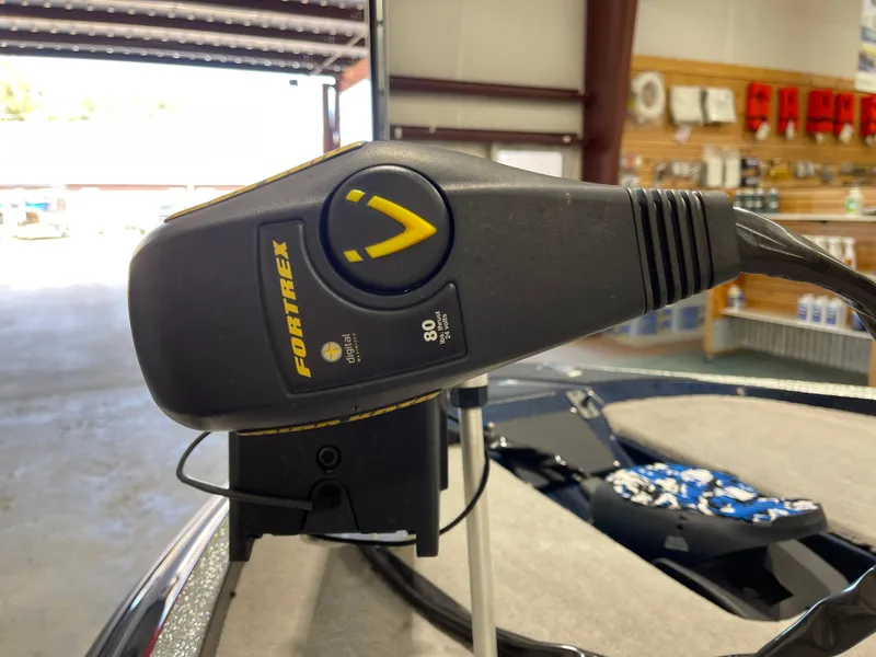 Slide: The Image of Close-up of a Fortrex trolling motor on a 2009 Triton 18 HP Explorer boat. - 11