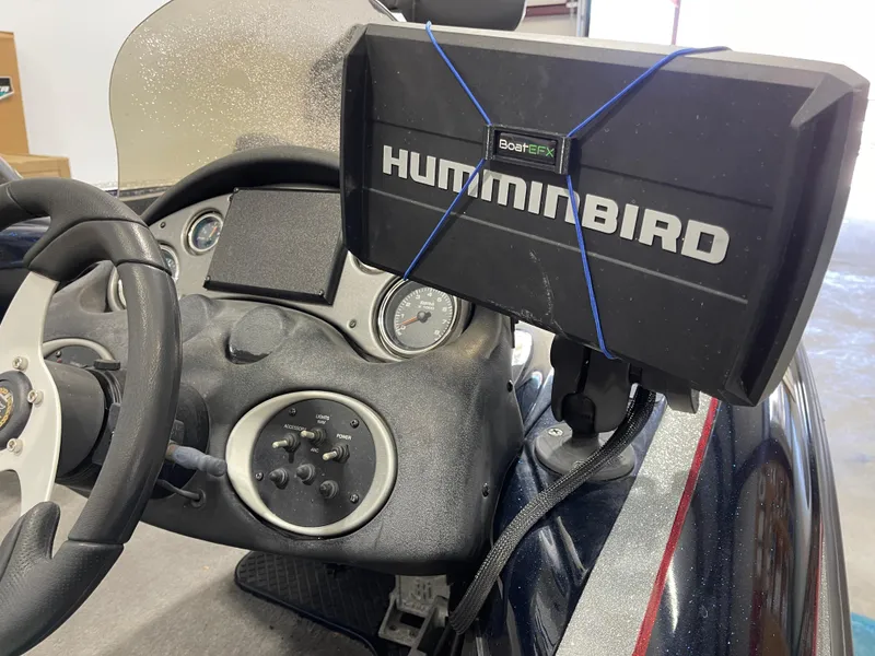 Slide: The Image of Dashboard of 2009 Triton 18 HP Explorer with Humminbird fish finder. - 19