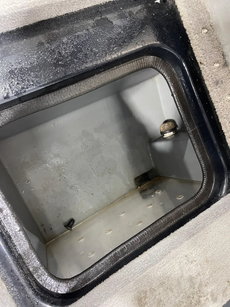 Slide: The Image of Open storage compartment in 2009 Triton 18 HP Explorer boat. - 24