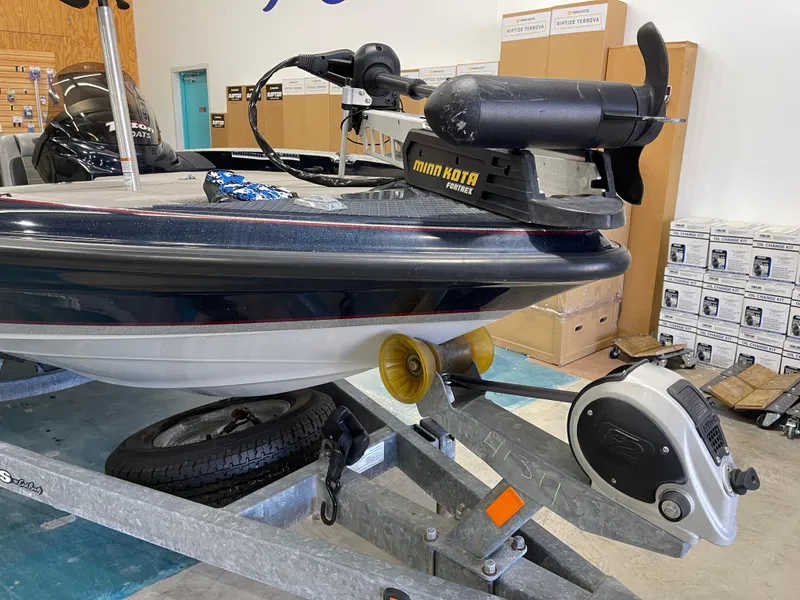 Slide: The Image of 2009 Triton 18 HP Explorer boat with Minn Kota Fortrex motor on trailer. - 6