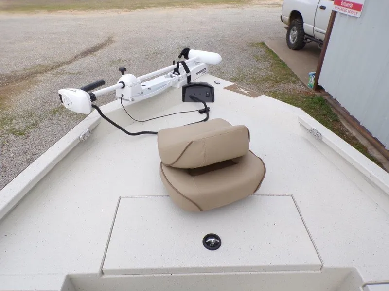 Slide: The Image of 2025 Xpress H20BAY boat deck with trolling motor and beige seat. - 12