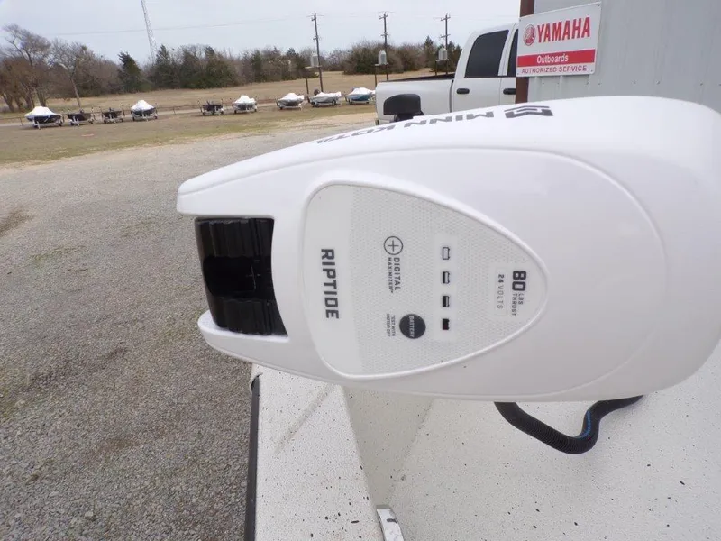 Slide: The Image of Riptide motor on 2025 Xpress H20BAY boat, Yamaha dealership in background. - 14
