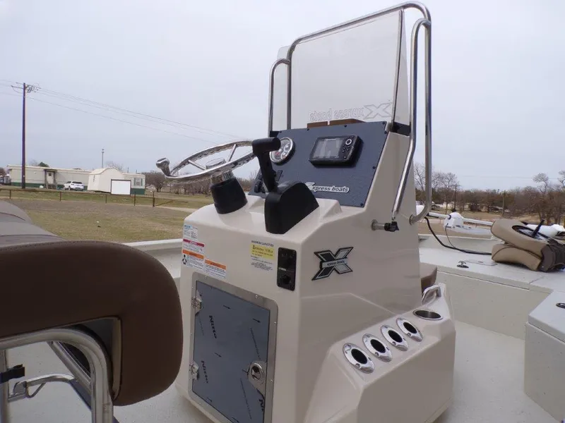 Slide: The Image of 2025 Xpress H20BAY boat console with steering wheel and controls. - 8