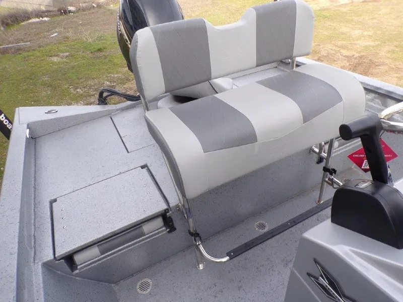 Slide: The Image of 2025 Xpress H20BAY boat interior with gray seating and storage compartments. - 11
